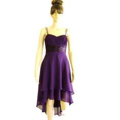 a mannequin dressed in a purple dress