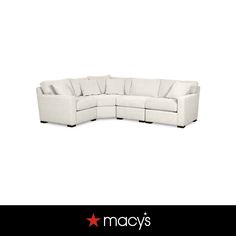 a white sectional couch sitting on top of a black and white background with the words macy's written below it