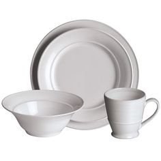 a white dinner set with two cups and saucers on the side, next to each other