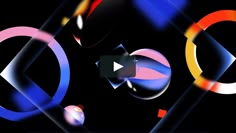 an abstract video background with different colored circles and shapes in the center, on a black background