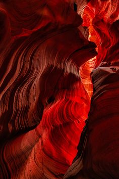 the light shines through the red rocks in the slot at antelope canyon