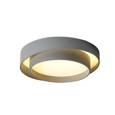 a circular light fixture on a white wall