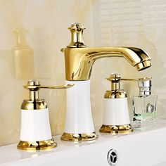 the faucet is gold and white in color