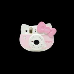 a hello kitty camera is shown against a black background