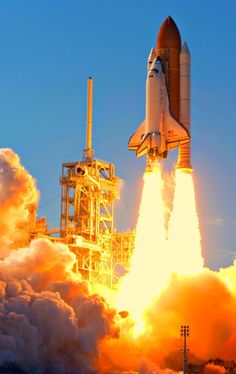 a space shuttle taking off from the launch pad