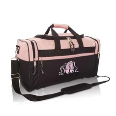 a pink and black duffel bag with an elephant on it's side, sitting against a white background