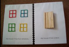 an open book with wooden pegs on top of it and the words my house is four windows