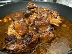 some food is cooking in a pan on the stove top and ready to be eaten