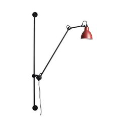 a red floor lamp with a black pole on the side and an orange light hanging from it's arm