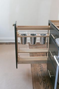 a kitchen with an oven and cabinets in it