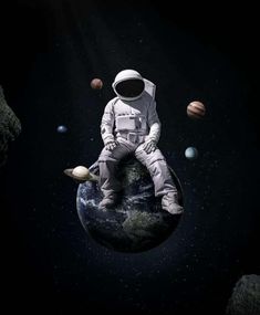 an astronaut sitting on top of the earth