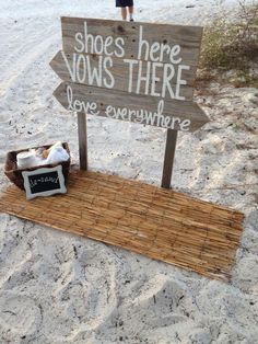 a sign on the beach that says shoes here vows there save everywhere with someone standing next to it