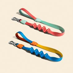 three lanyards in different colors on a white background