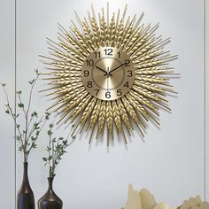 a clock that is on the wall next to vases