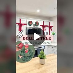 a kitchen decorated for christmas with red and green decorations on the wall, potted plant in front of stove