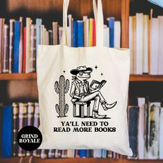 a tote bag that says ya'll need to read more books on it