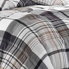 the comforter is made up with plaid sheets