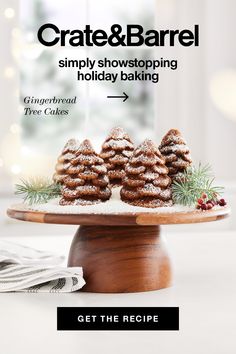 some cookies are sitting on top of a cake stand with the words crate & barrel simply showing holiday baking get the recipe