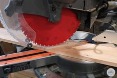 a circular saw is being used to cut wood