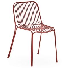 a red metal chair sitting on top of a white floor