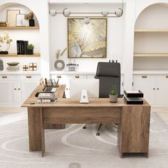 an office desk in the middle of a room with shelves on either side and a painting above it