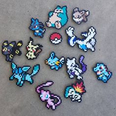 the pokemon characters are made out of pixelated paper and have been placed on top of each other