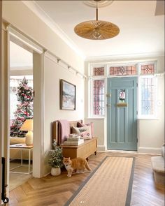 a living room filled with furniture and a blue door