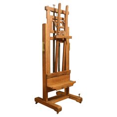 a wooden easel sitting on top of a table