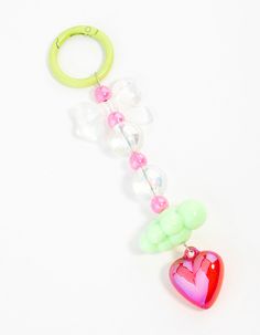 a key chain with a heart shaped object attached to it's end, on a white background