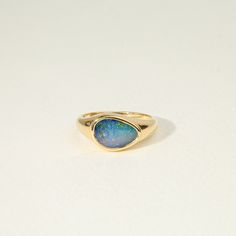 Blue Australian Opal Doublet Signet ring, Solid Gold signet ring, Fire opal Ring, October ring, australian opal ring, Gift ring for her,  Available in 9k/14k/18k yellow, rose or white gold as well as in Sterling silver Same design can be made also with other custom gemstones per request.  Product details: - Solid gold - Australian Opal Doublet - 1.8ct (Top Quality) - Made to order - 8 to 10 business days. Ring size - US 3 to US 9 (for smaller or larger ring size, please contact) Please select yo Handmade Blue Opal Rings, Opal Signet Ring, Luxury Handmade Blue Opal Ring, Unique 14k Gold Opal Cabochon Ring, Blue Opal Cabochon Ring, Signet Ring Women, Opal Gold Ring, Opal Stone Ring, Signet Rings Women