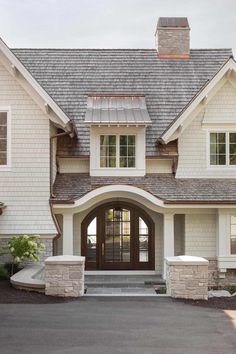 a white house with a brown front door