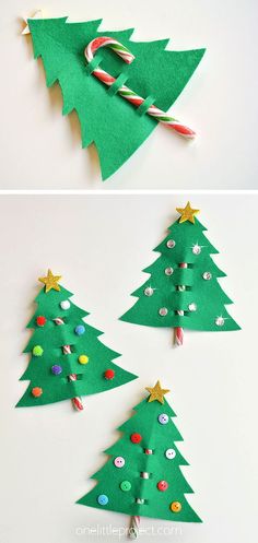 three christmas trees made out of felt with candy canes on the top and bottom