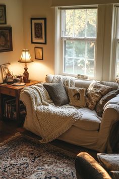 a living room filled with furniture and lots of windows