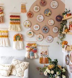 the wall is filled with plates and flowers