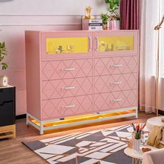 a pink and yellow dresser in a living room