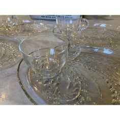 three clear glass dishes sitting on top of a table