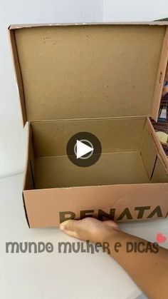 a person opening a box with pictures inside