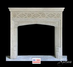 a white marble fireplace with an ornate design