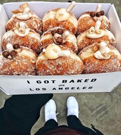 a box filled with lots of donuts covered in icing