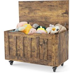 a wooden crate filled with stuffed animals on wheels