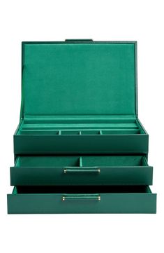 two green leather boxes are stacked on top of each other, one is open and the other is closed