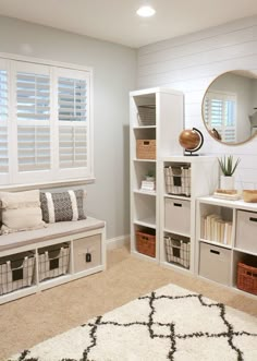 a living room filled with lots of white furniture