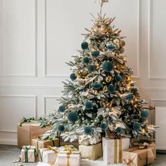 a decorated christmas tree with presents under it