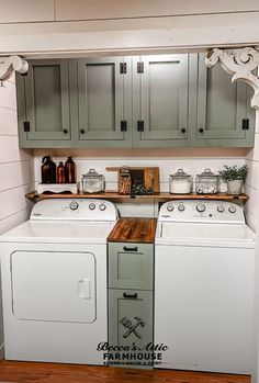 a white washer and dryer sitting in a kitchen