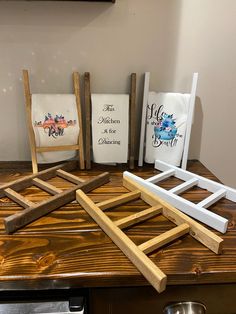 three wooden frames sitting on top of a table