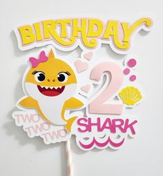 a birthday cake topper with a shark on it and the number twenty two sharks