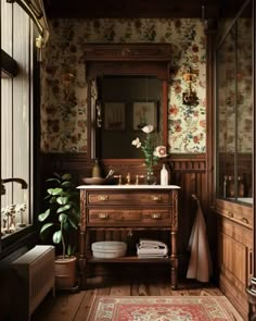 an old fashioned bathroom with floral wallpaper and wood paneling, along with a rug on the floor