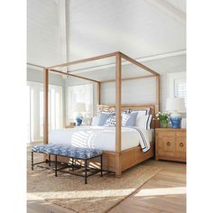 a bedroom with white walls and wooden furniture