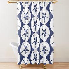 a blue and white shower curtain with circles on it