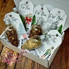 a box filled with different types of spices and seasoning on top of a wooden table